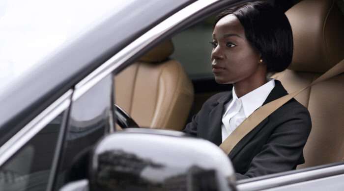 female-taxi-driver-paying-attention-road