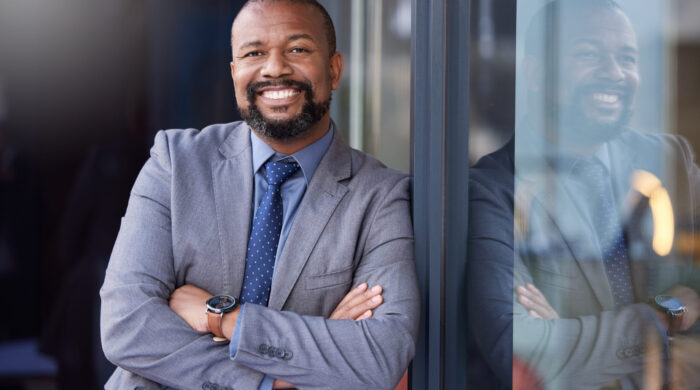 Shot of a businessman wearing a suit while standing outside.