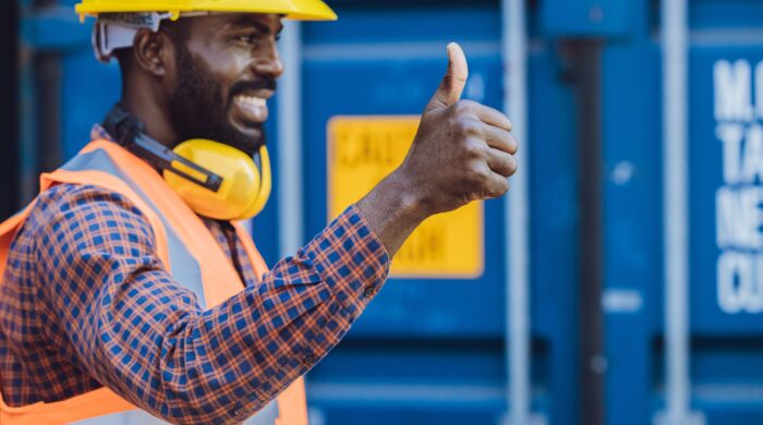 worker thumbs up hand sign good job best working approved, selective focus at hand