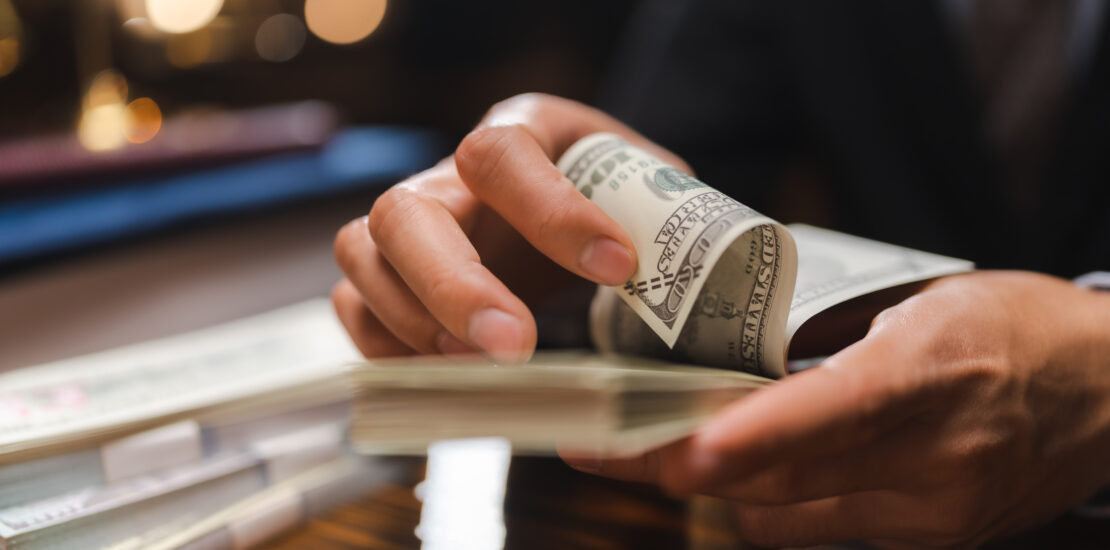Business Hands Holding Dollar Bank, Bookkeeper Financial Inspector Checking A Money