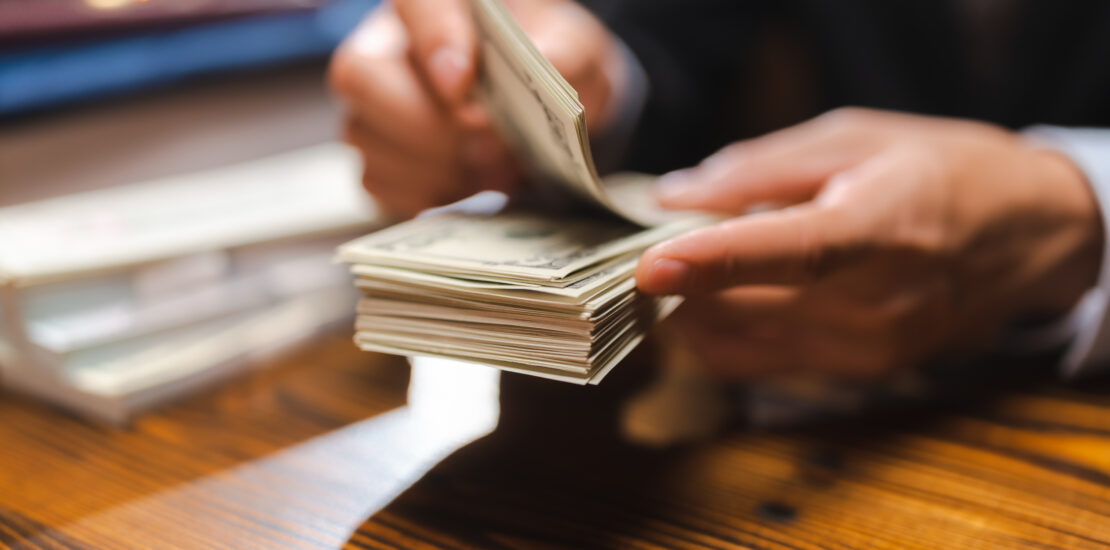 Business Hands Holding Dollar Bank, Bookkeeper Financial Inspector Checking A Money