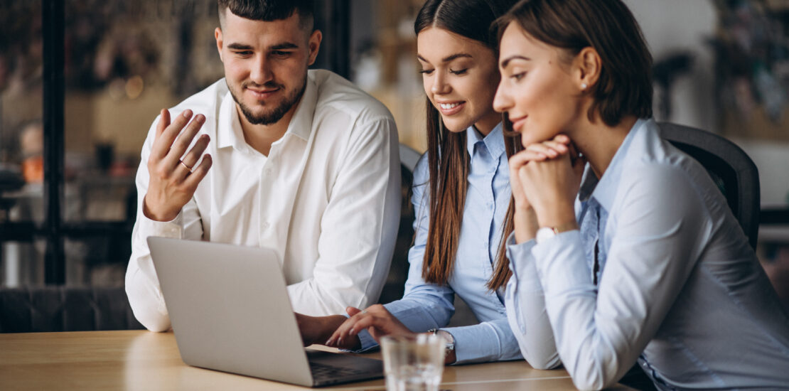 Group Of People Working Out Business Plan In An Office