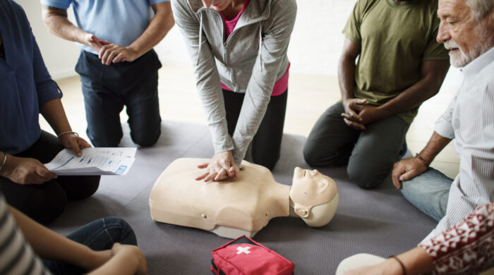 Group of diverse people in cpr training class